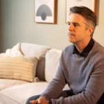 man thinking in therapy office