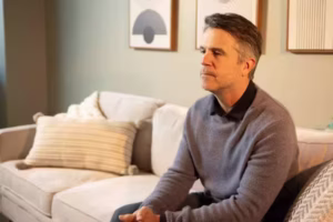 man in therapy thoughtful