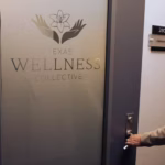 Texas Wellness entry door with logo